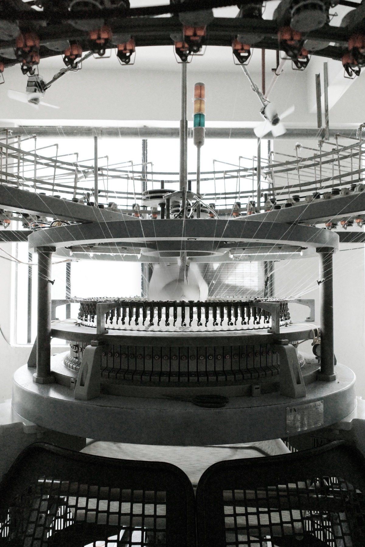 Circular knitting machinery used during textile production