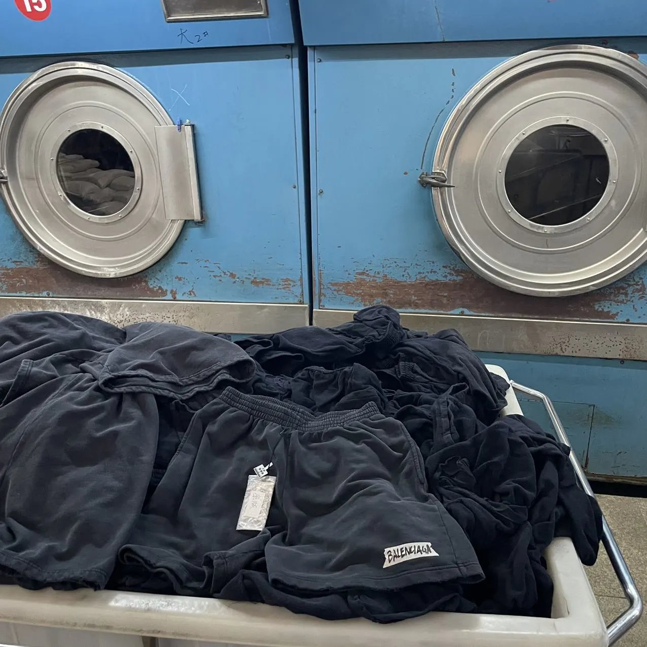 Shorts beside washing equipment