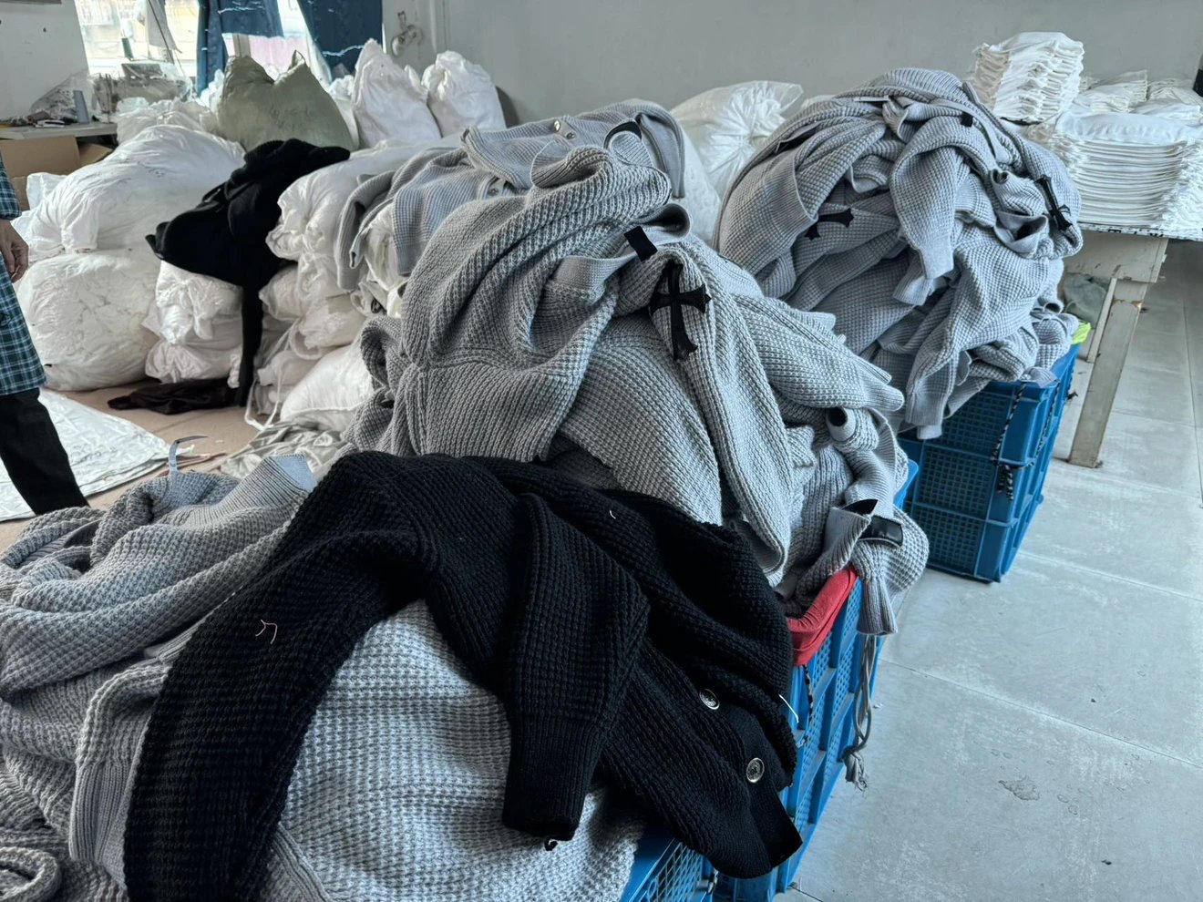 Black and grey garment stacks