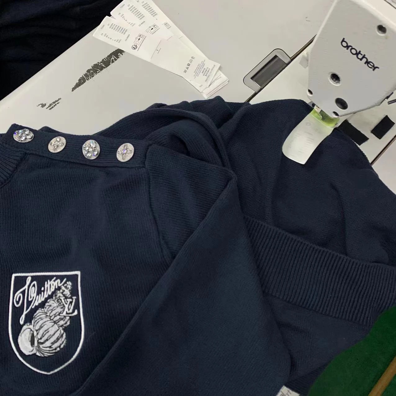 Garment and button assembly