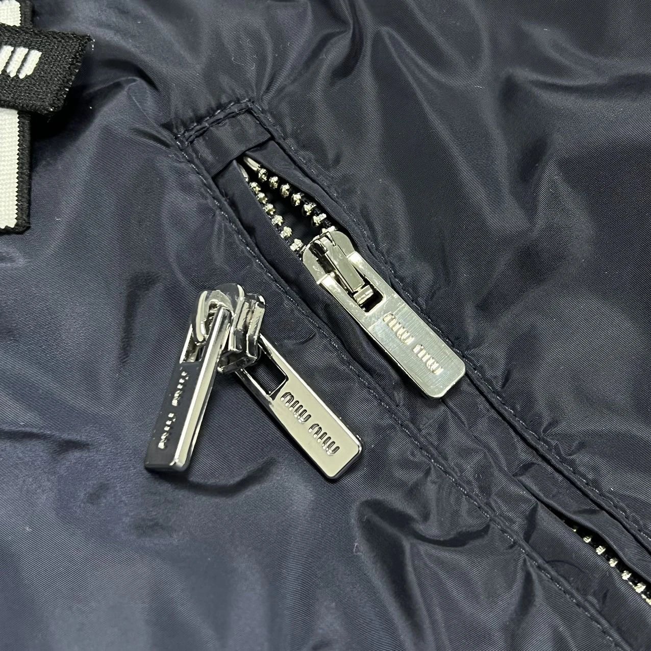 Attached zipper pulls