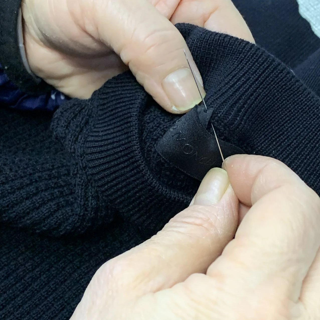Hand-stitched neck label