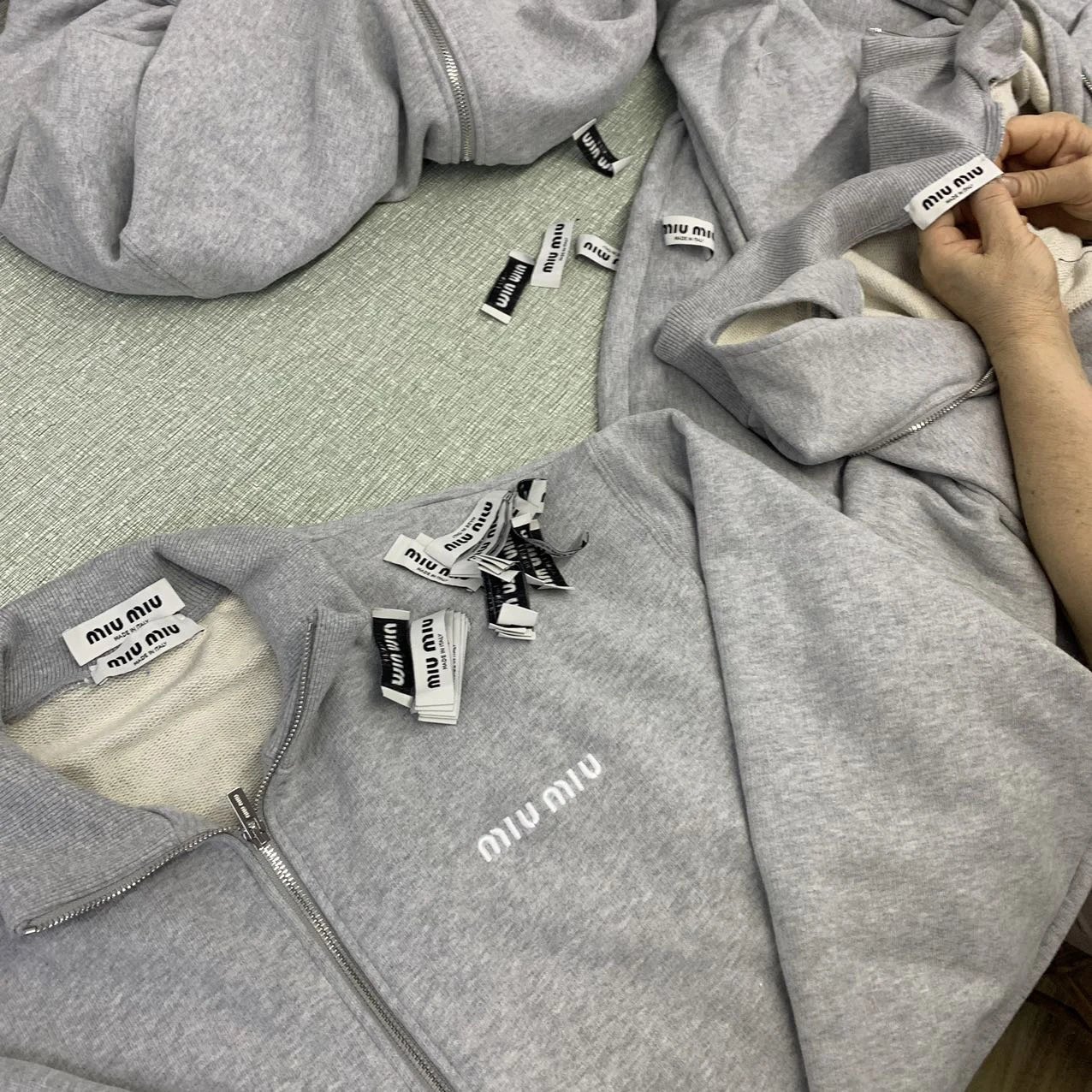 Hand-attached neck labels